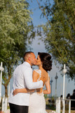 Romanic wedding couple posing in park