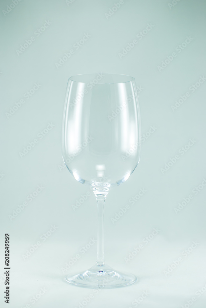 Closeup of a transparent empty wine glass. Isolated on the white background. Closeup of a transparent empty wine glass. Isolated on the white background.