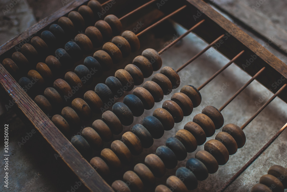 Old wooden abacus laying on the dusty floor of the storage. Closeup Old wooden abacus laying on the dusty floor of the storage. Closeup