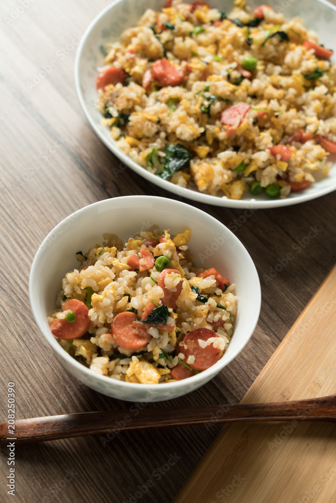 Fried rice with egg and wood grain background Fried rice with egg and wood grain background