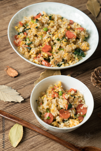 Fried rice with egg and wood grain background