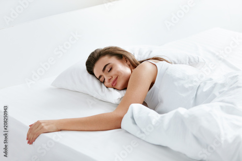 Healthy Sleep. Woman Sleeping On White Bedding photo