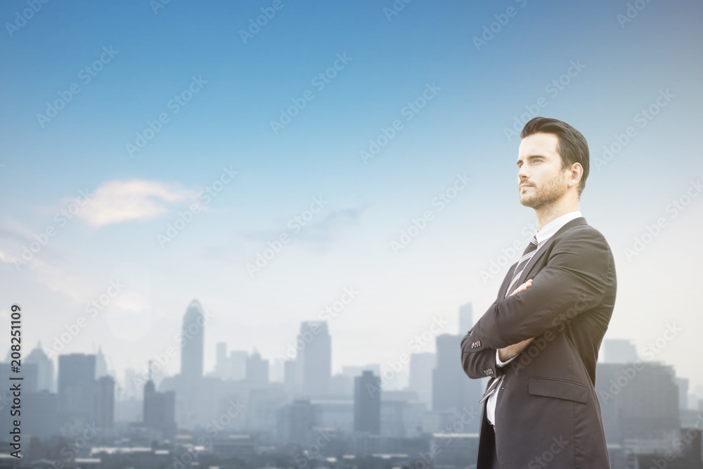 businessman standing on top of building and looking forward, concept as set goal, Committed and have vision concept businessman standing on top of building and looking forward, concept as set goal, Committed and have vision concept
