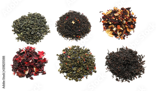 Variety of dry tea leaves on white background