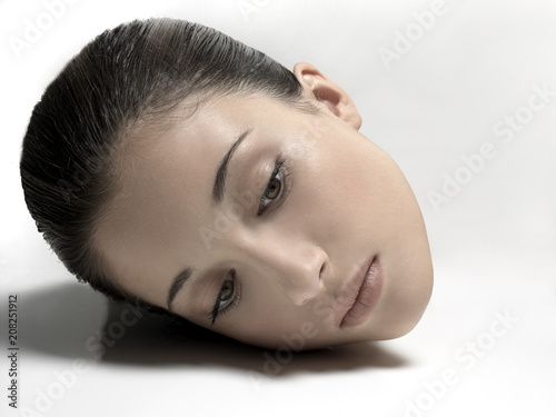 female head resting on a floor