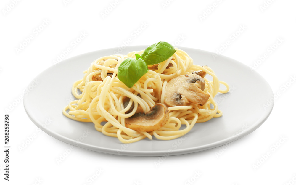 Plate of delicious pasta with mushrooms on white background