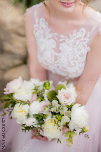 Beautiful bride with wedding bouquet.