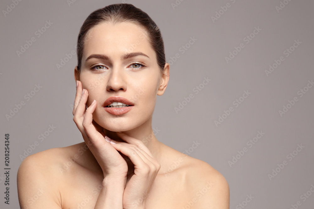 Beautiful young woman with natural makeup on color background Beautiful young woman with natural makeup on color background