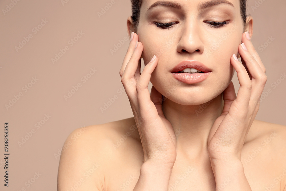 Beautiful young woman with natural makeup on color background, closeup Beautiful young woman with natural makeup on color background, closeup