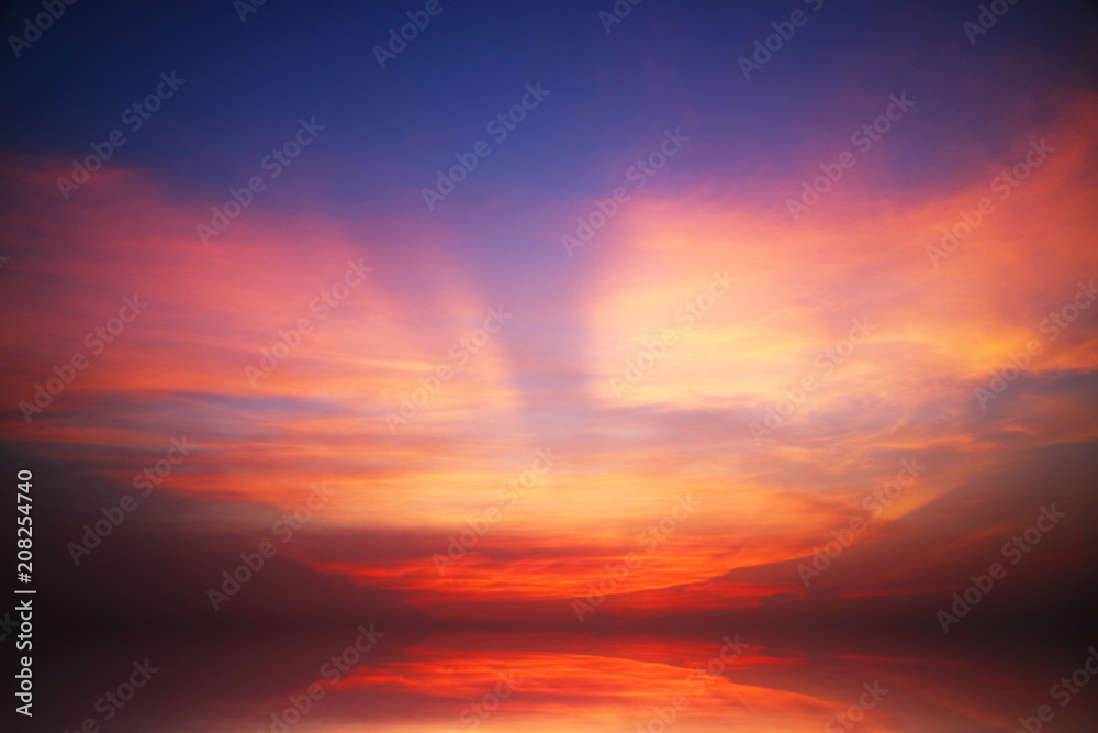 reflection of sunset heap cloud on sea water surface