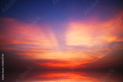 reflection of sunset heap cloud on sea water surface © darkfoxelixir