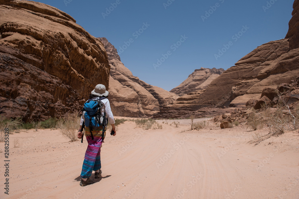 Woman trekking in the desert