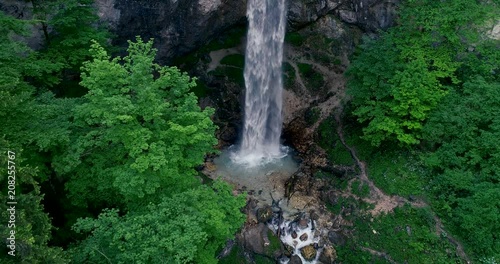 drone flight over giant big waterfall called Wildensteiner waterfall in austria photo