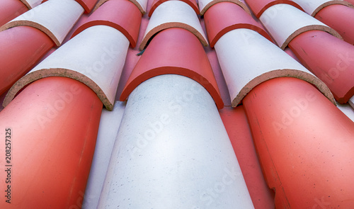 Close-up of Typical white and red Teja Curva, curved Latin country roof tiles covering the buildings of Hotel Quintal Splendida in Canico Madeira photo