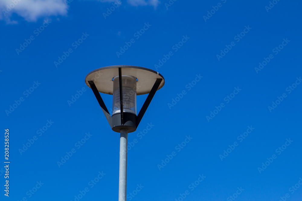 Street lamp LED with solar energy and blue sky with clouds