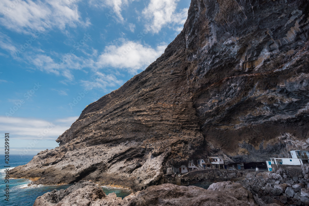 Hidden houses in the tourist attraction pirate cave of El Poris de Candelaria, in La Palma island, Canary islands, Spain.