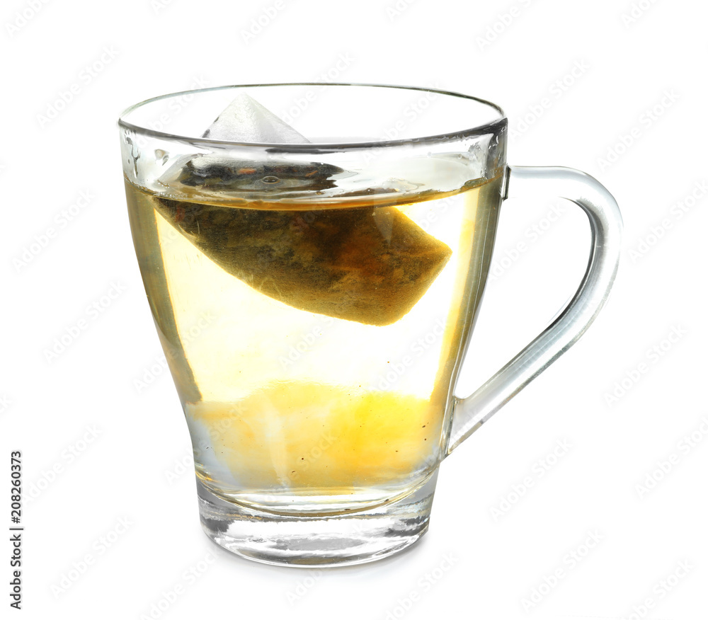 Brewing of hot beverage in glass cup using teabag, on white background Brewing of hot beverage in glass cup using teabag, on white background