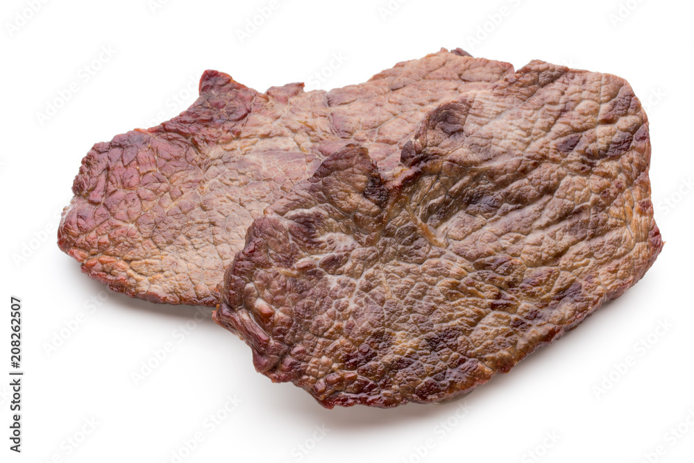 Grilled beef steaks with spices isolated on white background. Grilled beef steaks with spices isolated on white background.