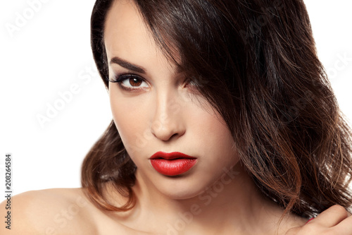 Portrait of young woman with beautiful professional makeup on white background  closeup