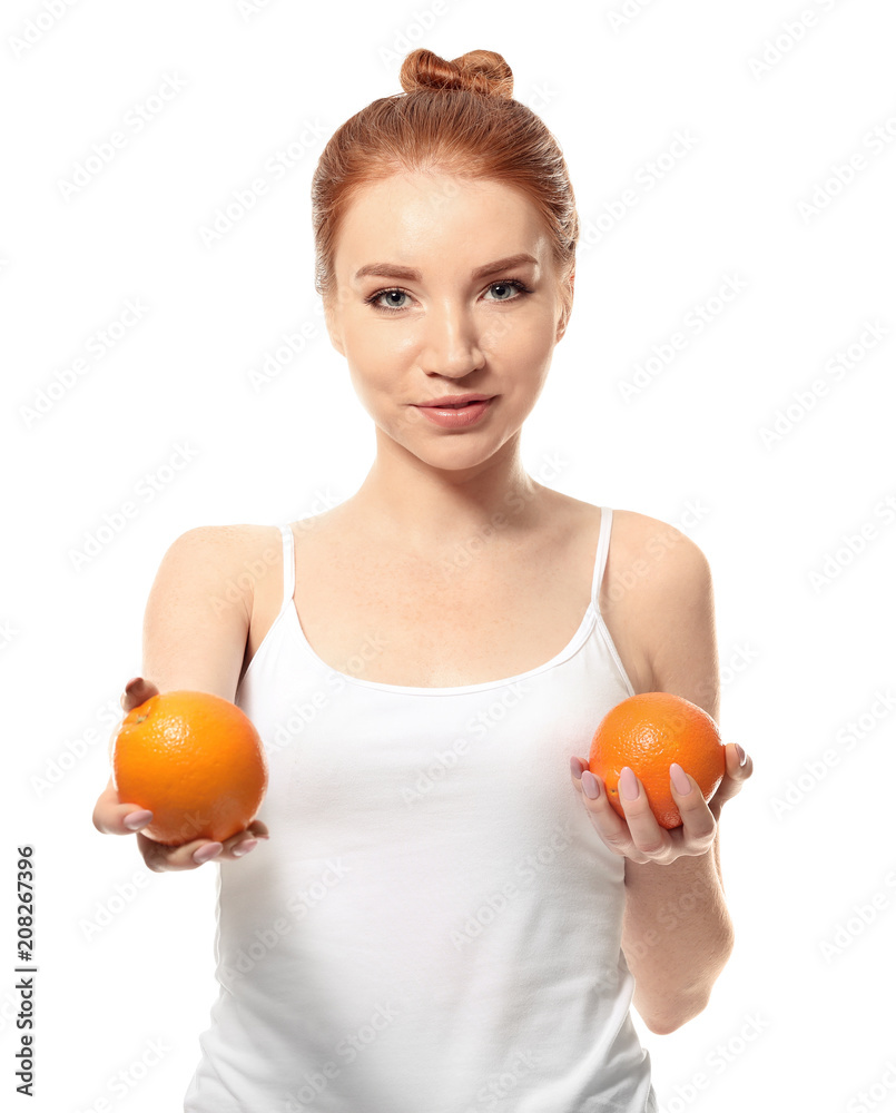 Beautiful young woman with citrus fruit on white background Beautiful young woman with citrus fruit on white background