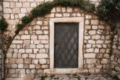Old Door and Stone Wall in Dubrovnik, Croatia