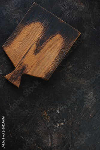 Background with a rustic wooden chopping board and lots of space, flatlay, vertical shot