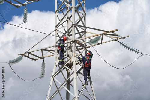 High Voltage Power Line workers © Sergei