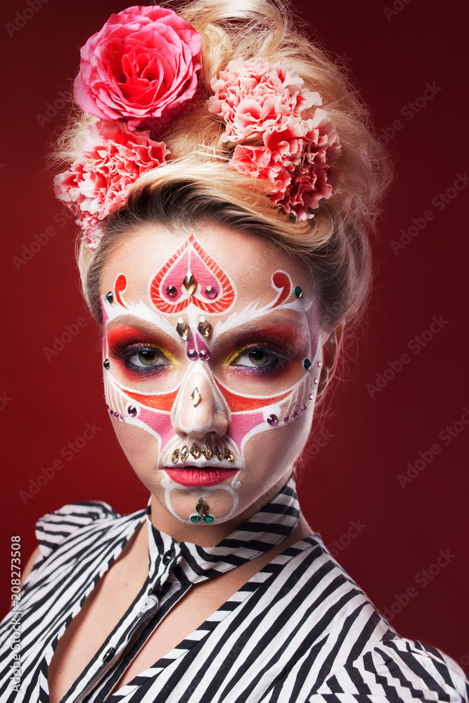 Young beautiful woman with skull makeup. Mexican day of the dead Young beautiful woman with skull makeup. Mexican day of the dead