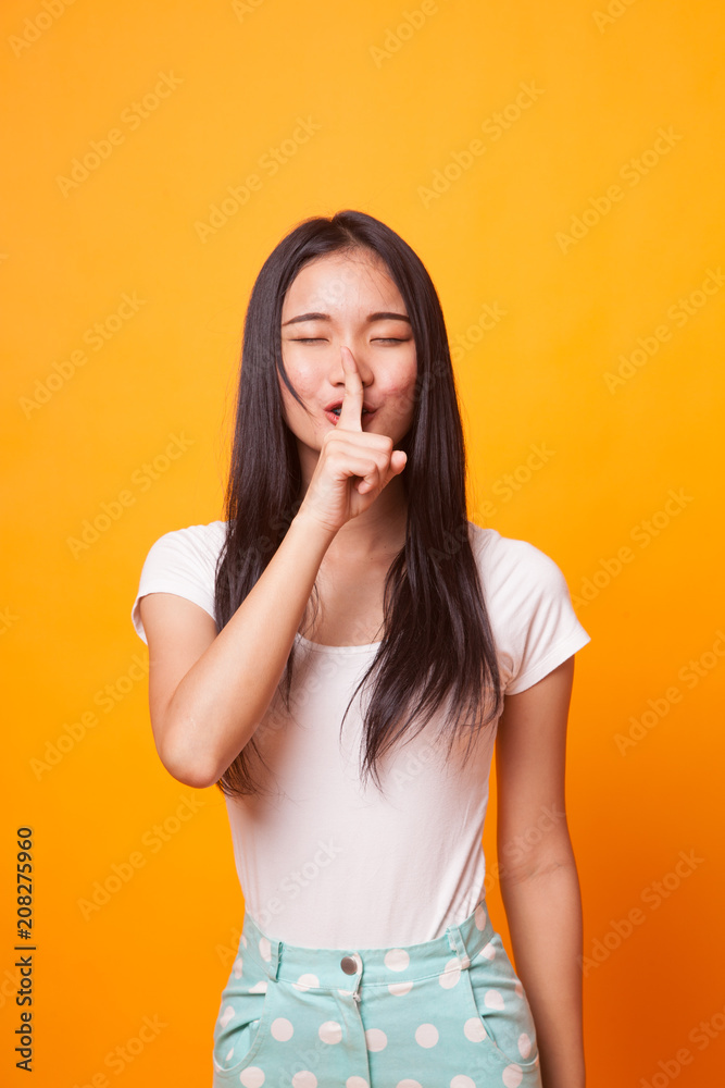 Asian girl smile show quite hand sign.