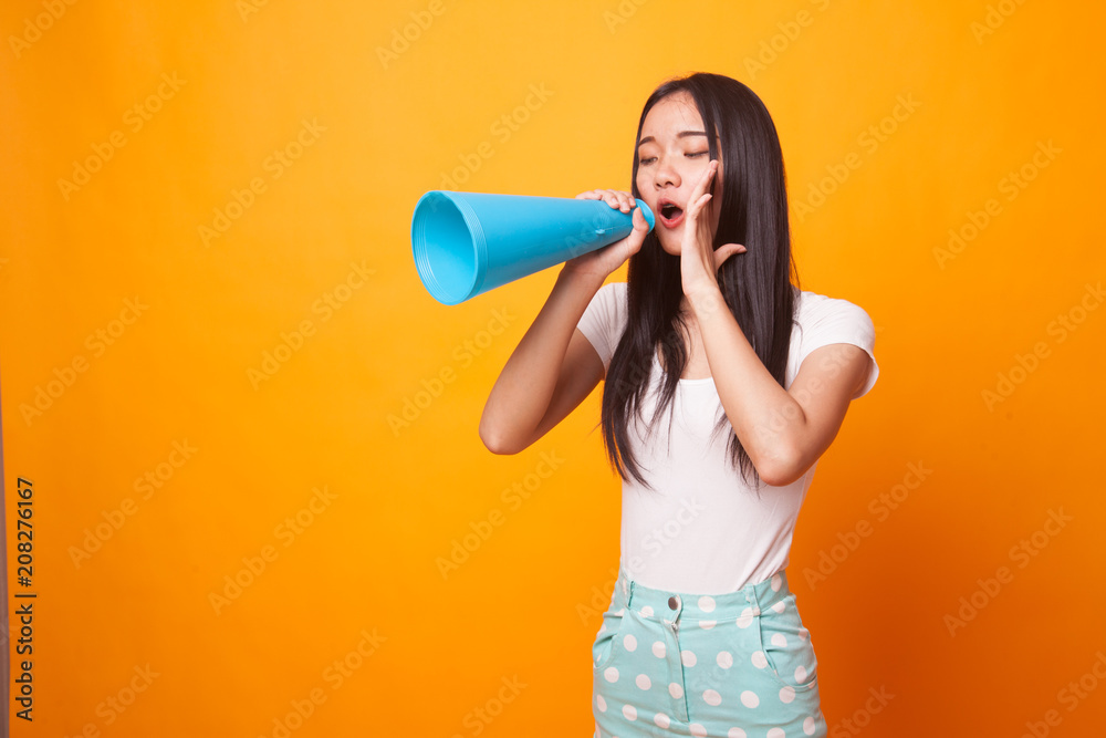 Beautiful young Asian woman announce with megaphone. Beautiful young Asian woman announce with megaphone.