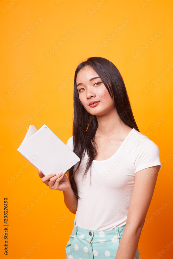Young Asian woman with a book.