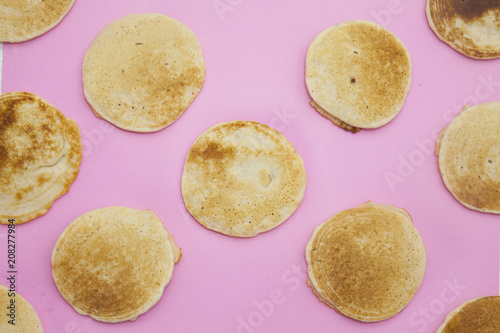pancake pattern on a pastel pink background