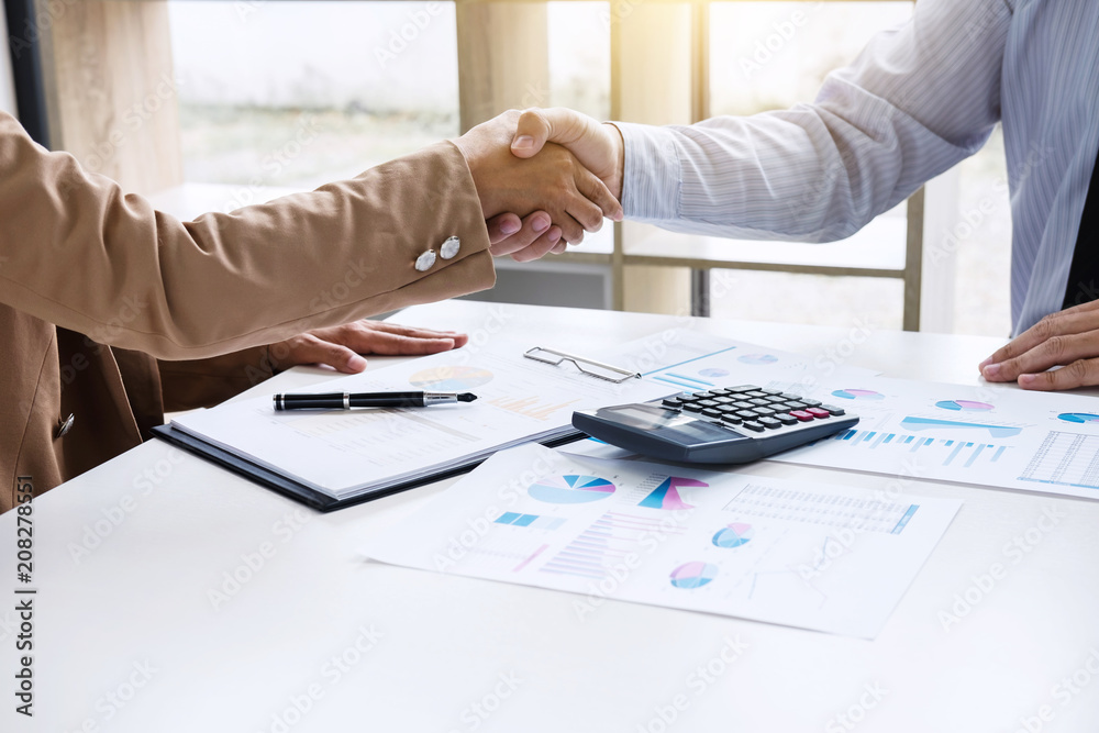 Business partnership meeting concept, Two confident Business handshake and business people after discussing good deal of Trading contract and new projects for both companies, success, partnership Business partnership meeting concept, Two confident Business handshake and business people after discussing good deal of Trading contract and new projects for both companies, success, partnership