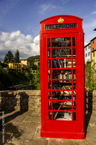 British telephon box full of books in Barga, Italy