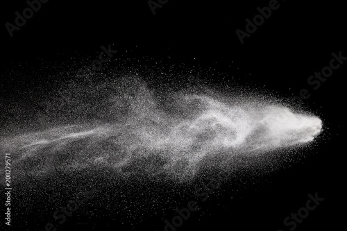 Bizarre forms of  white powder explosion against dark background. Launched white particle splashing.