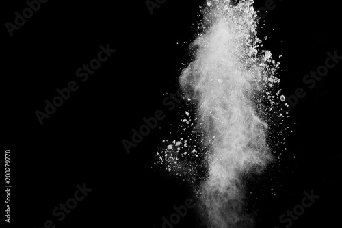 Fototapeta Naklejka Na Ścianę i Meble -  Bizarre forms of of white powder explosion cloud against dark background.Launched white dust splash on black background.