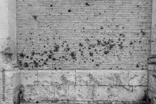 old brick wall with bullet holes near Dunkirk France
