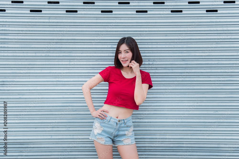 Obraz premium Portrait of asian woman sit on the road,Beautiful thailand people,Happy woman concept,Lifestyle of modern girl