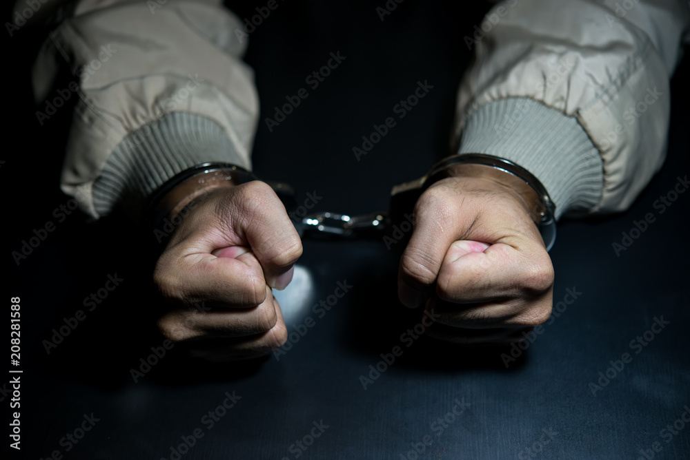 Fototapeta premium The suspect was arrested at the investigation, interview to find out the truth, the thief was caught by the police come to the dark room,Thailand people