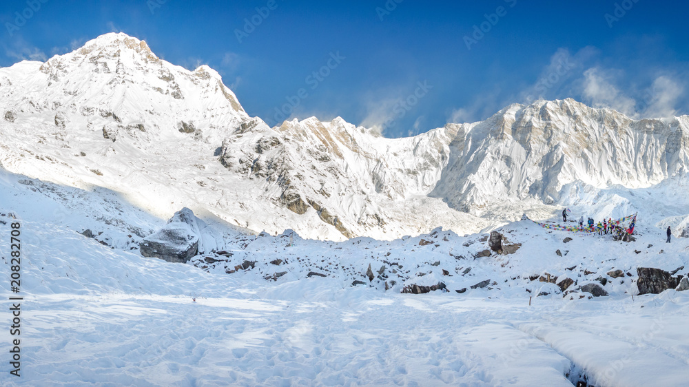 Panorama of snow and mountain Range Landscape with Blue Sky from Annapurna range, Nepal Himalayas.