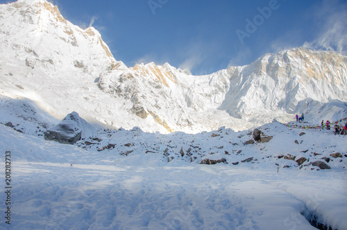 Panorama of snow and mountain Range Landscape with Blue Sky from Annapurna range, Nepal Himalayas.