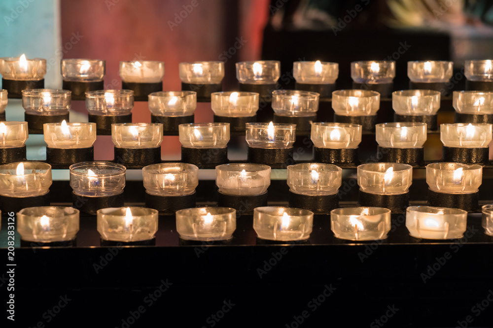 Religion Candle in cathedral - selective focus Religion Candle in cathedral - selective focus