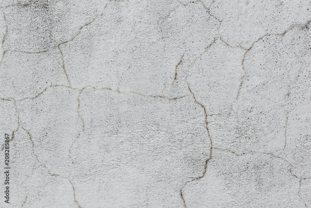 Fototapeta premium Wall fragment with scratches and cracks