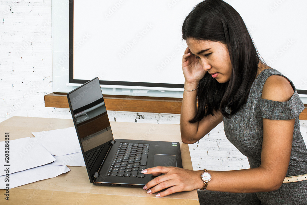 Girl with low energy at office needs coffee to work at her job. Girl with low energy at office needs coffee to work at her job.