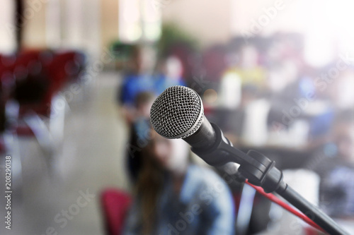 Microphone close-up against a blurred hall