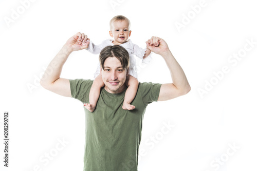 Father holding small cute baby on studio white background shoulder