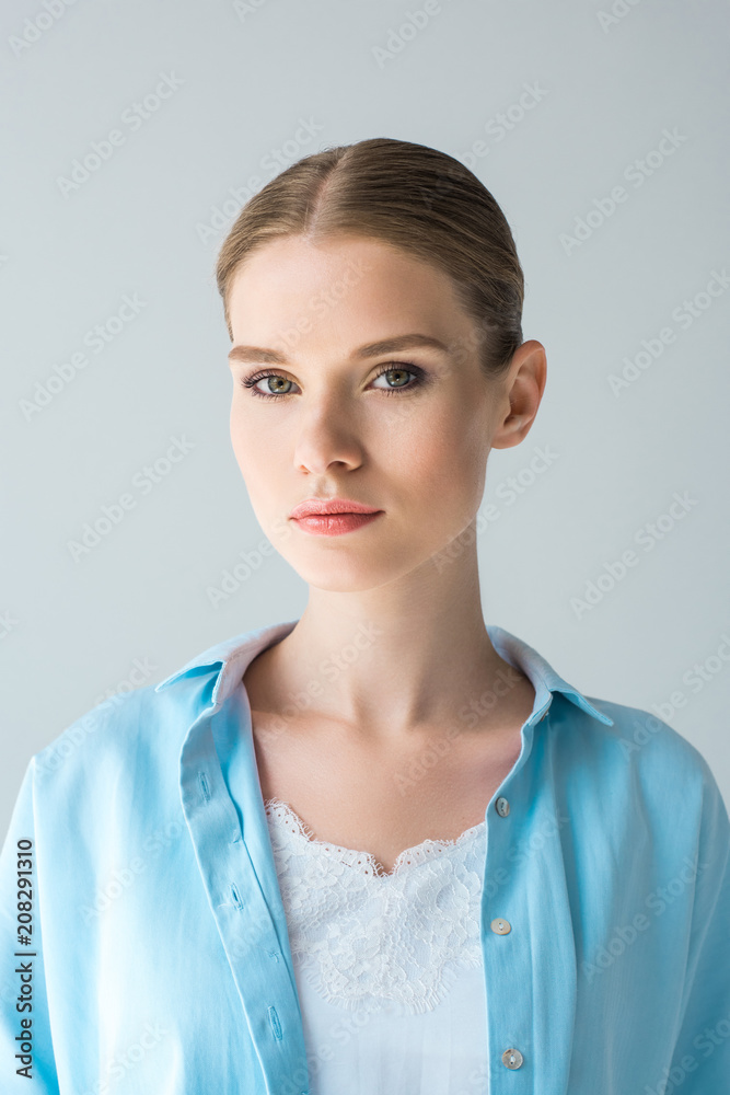 close-up portrait of attractive young woman isolated on grey close-up portrait of attractive young woman isolated on grey