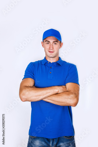 Delivery Concept: Portrait Young caucasian Handsome delivery man or courier