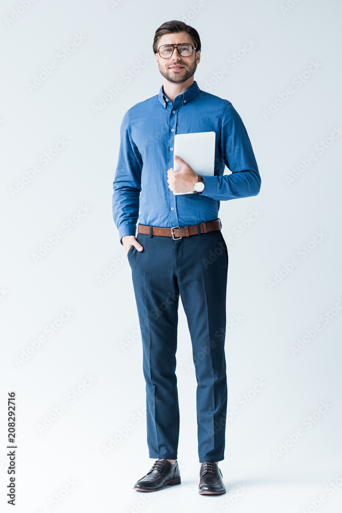 happy young man in stylish clothes with tablet on white happy young man in stylish clothes with tablet on white