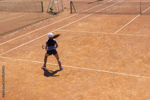 Woman playing tennis. Young tennis player with a racket. girl playing tennis.